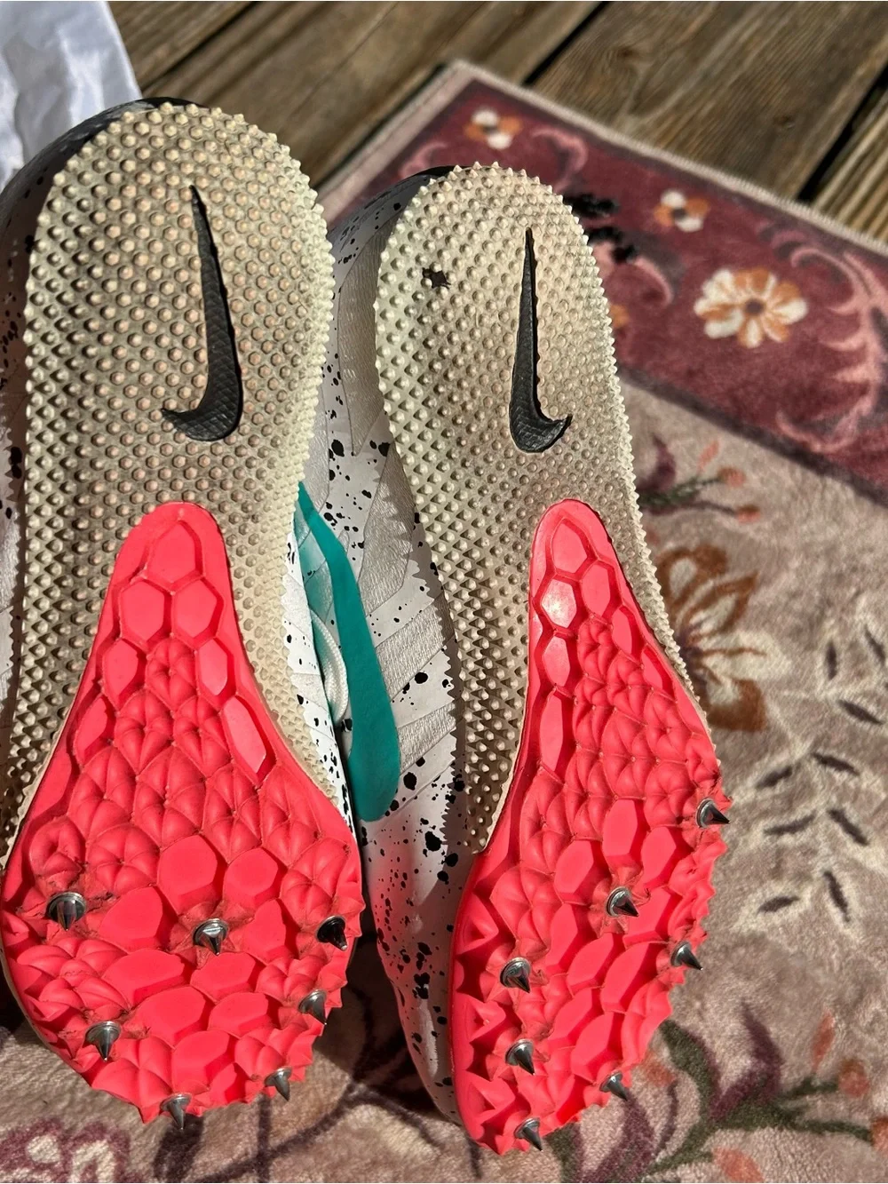 Nike White Track and Field shoes with Pink Swoosh / Teal with Black Speckles .